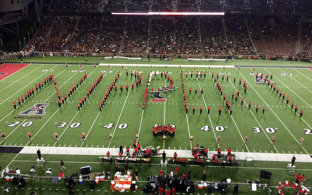Nippert Stadium field with the band spelling out the word Nippert