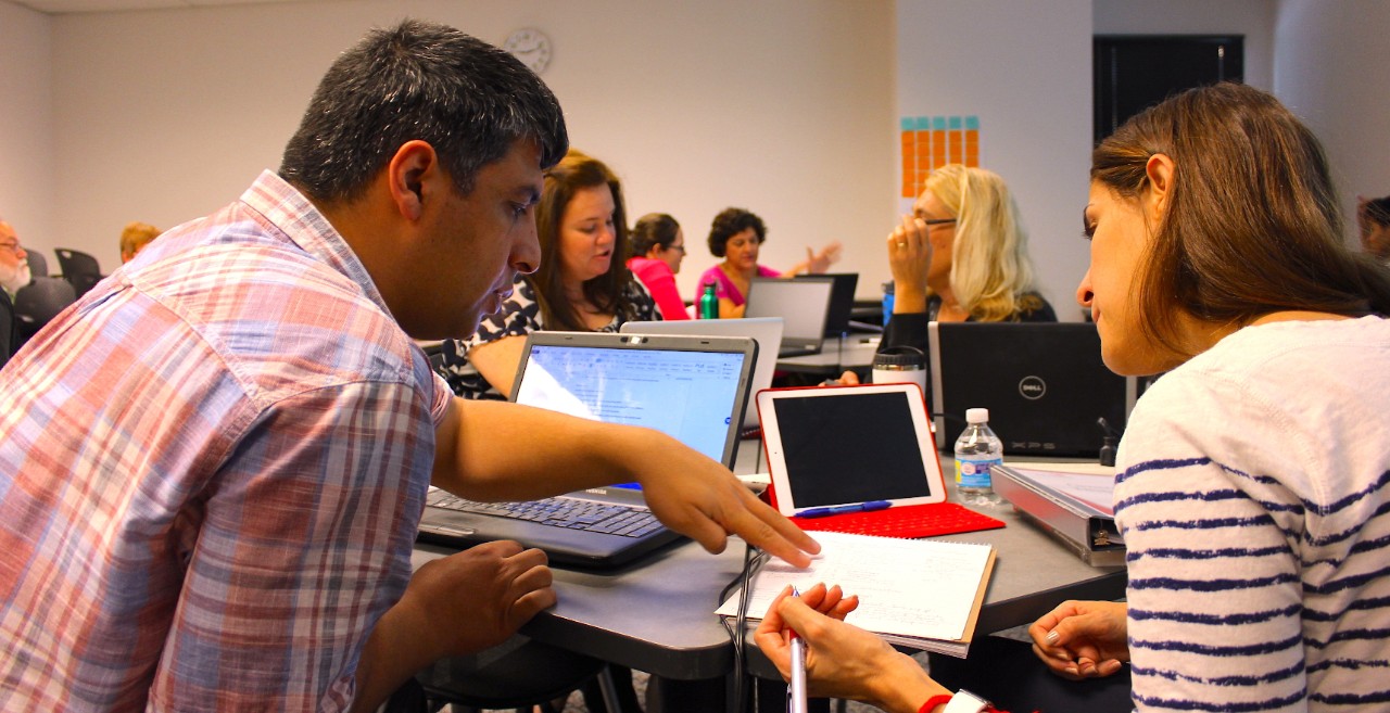 someone assisting a student with a question