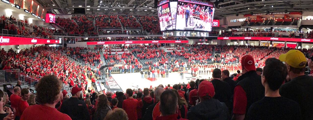The UC Fifth Third Arena packed with fans watching a UC Men's Basketball Game.