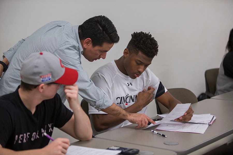 faculty talking with student