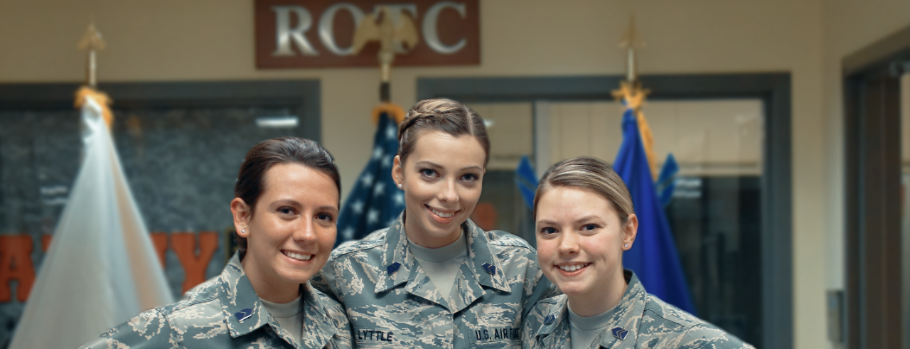 Three AFROTC students smiling