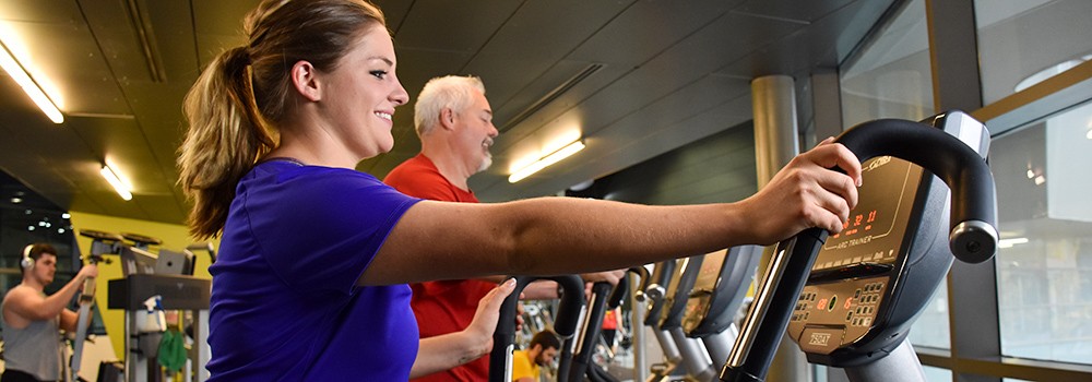 Guests exercising on treadmills at the Campus Recreation Center.