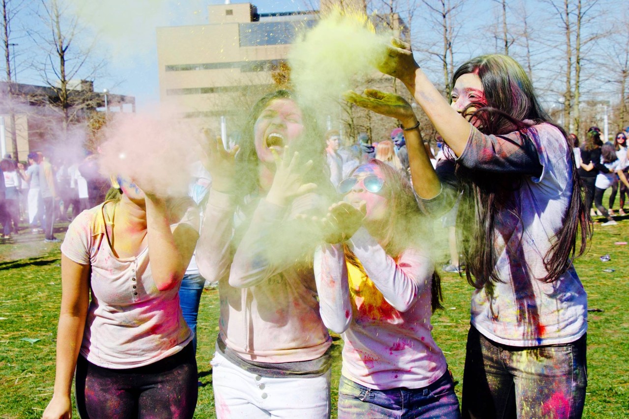 Group of 4 women at 2018 WorldFest event Holi