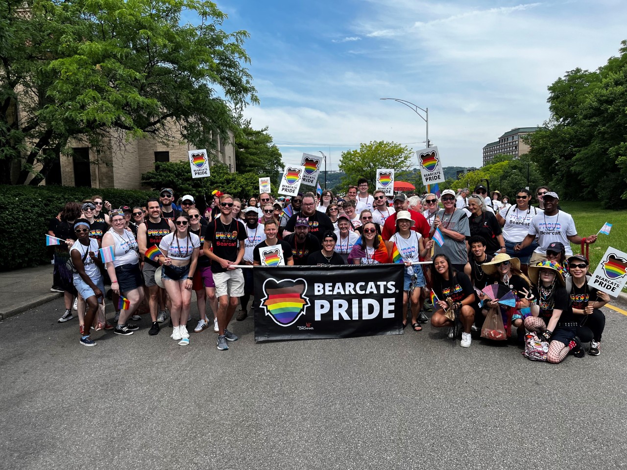 UC community members at Cincinnati Pride 2022 holding a Bearcats Pride banner