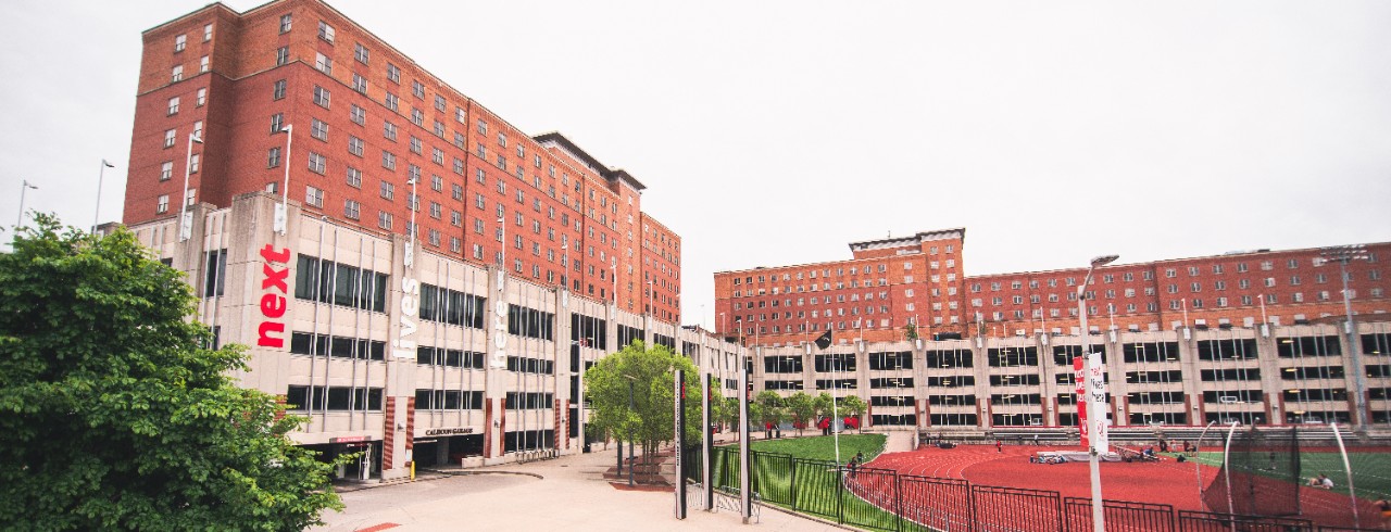 The entrance to Calhoun Garage from Corry Boulevard. Much of the garage can be seen with University Park Apartments above. The entrance is near Gettler Stadium.