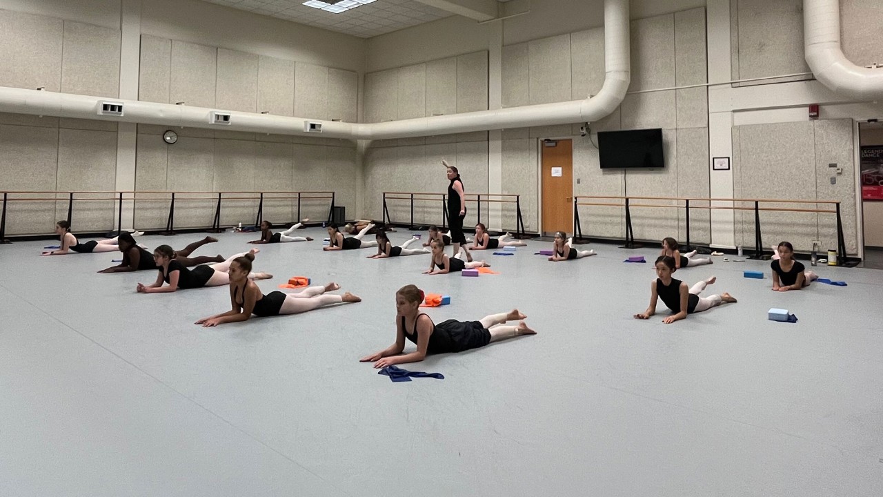 Ballet students in rehearsal in a dance studio