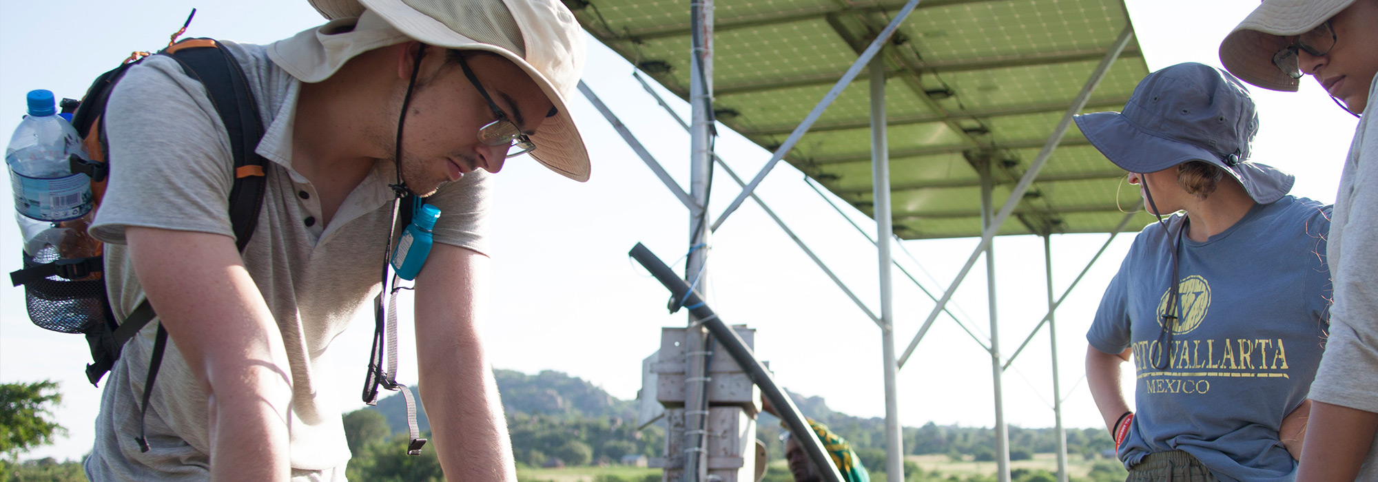 Engineering student Alex Wahl observes work on a water line