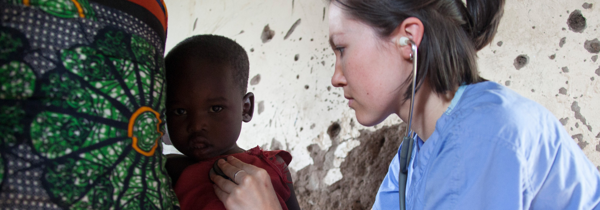 UC Med student Katie Brown examines a child in Tanzania