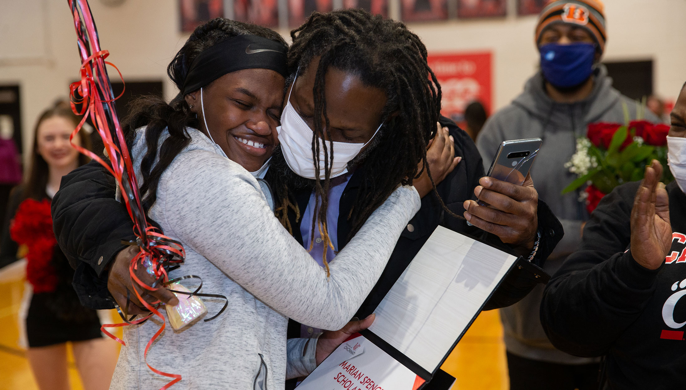 A future UC student shares a celebratory embrace