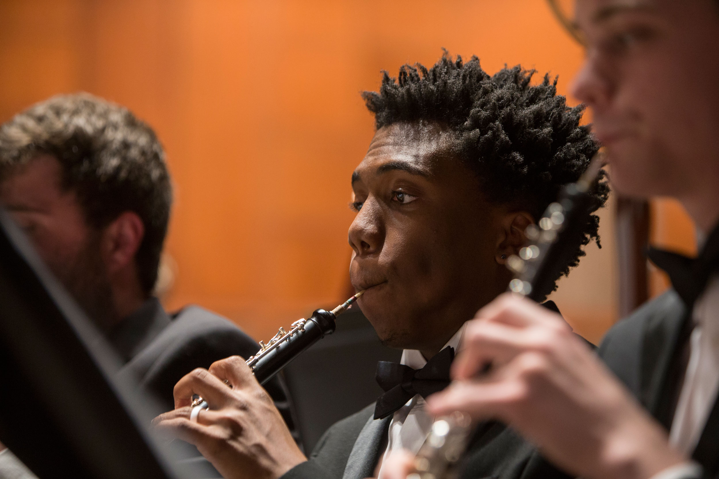 A CCM student plays oboe in an ensemble