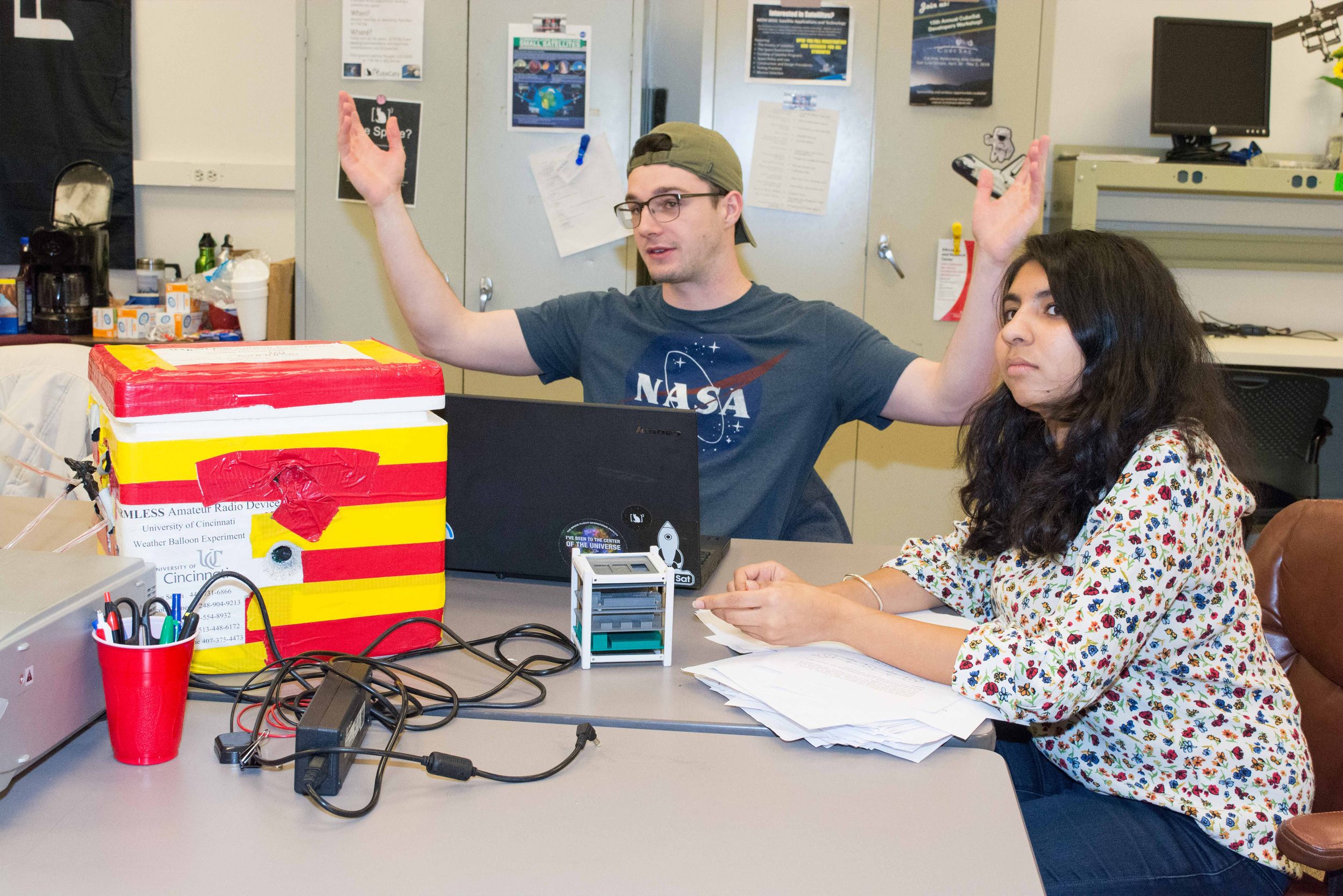 Members of UC's Cube Cats group meet in a classroom