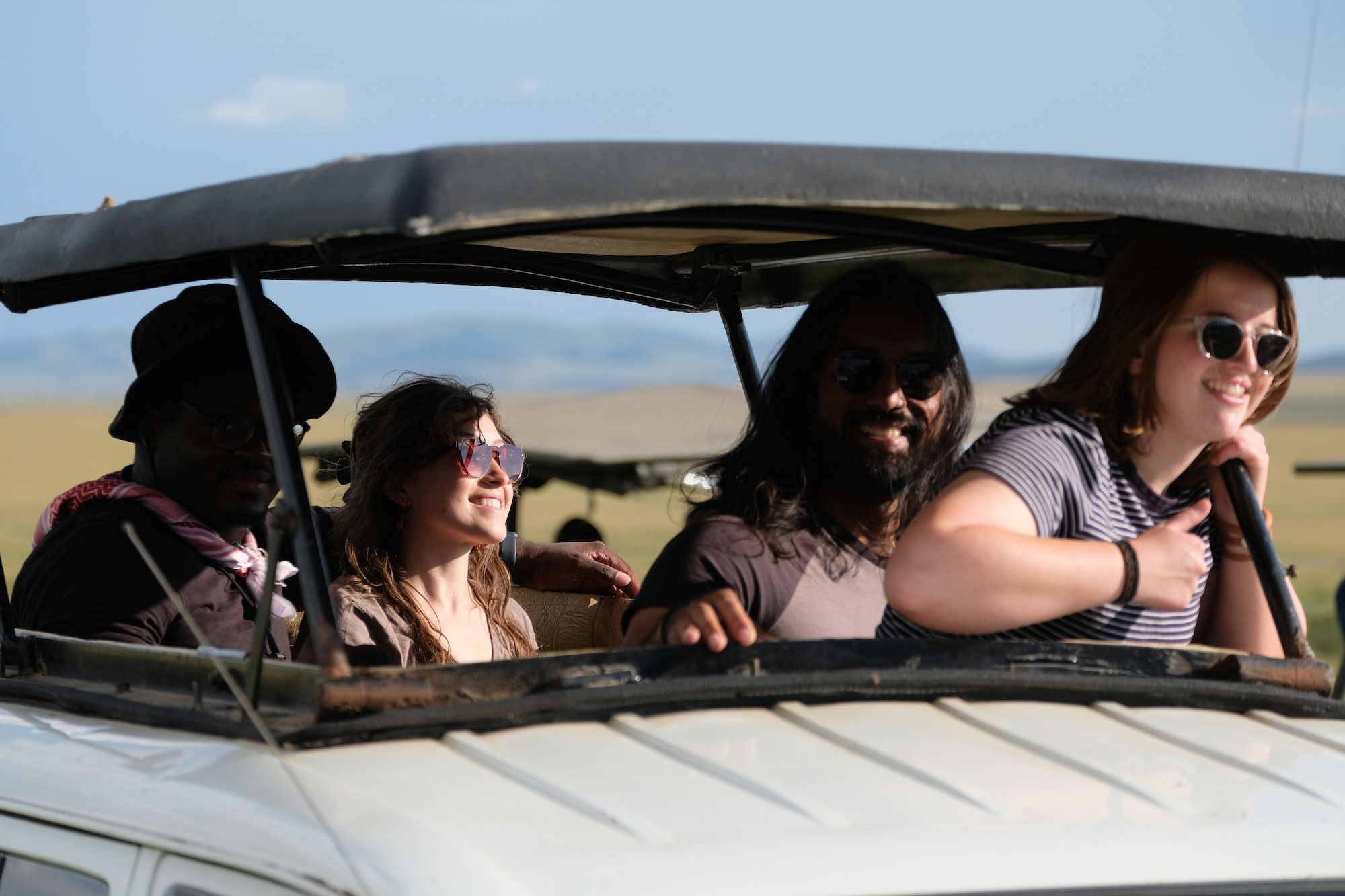 University of Cincinnati students watch animals from a safari vehicle