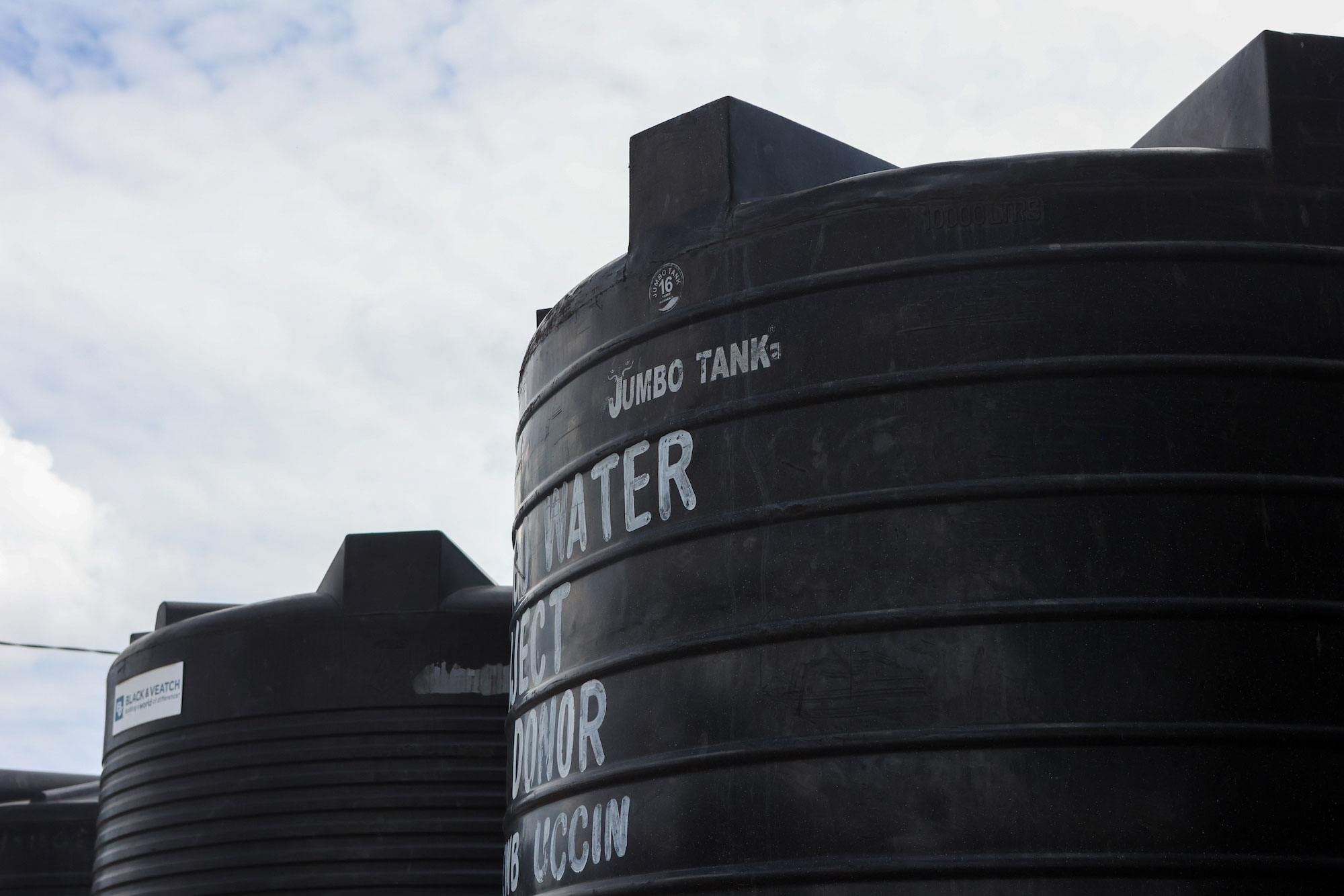 Two large black water tanks