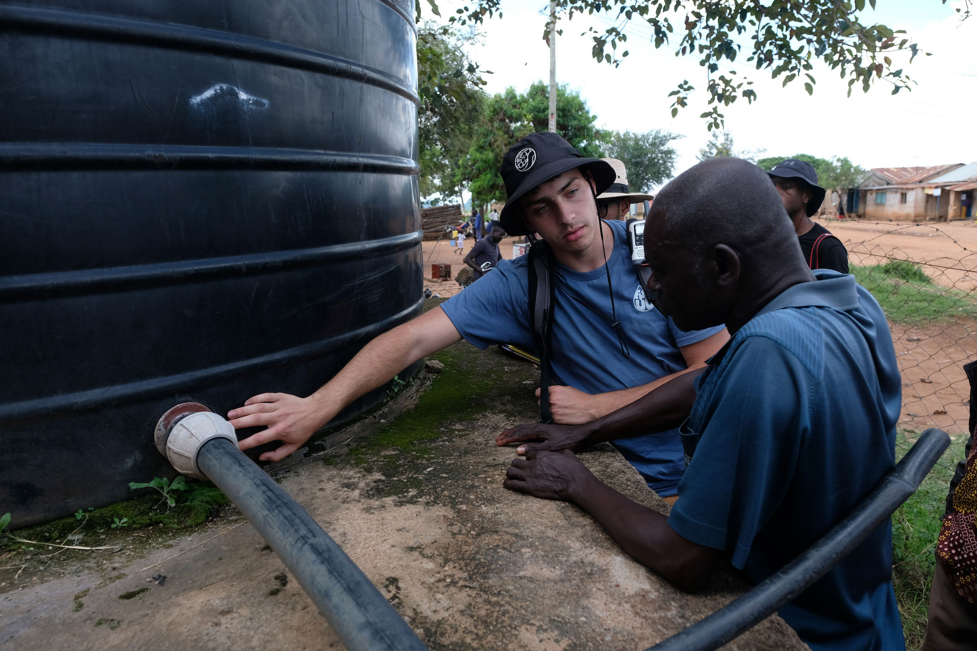 Nabil Djafi inspects a water filtration system in Tanzania