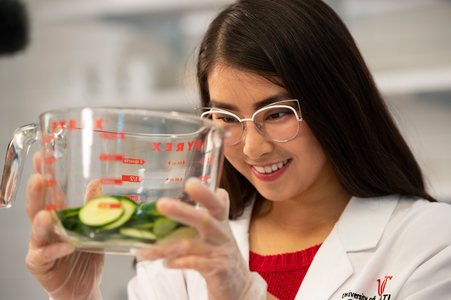 A Nutrition Sciences student anazlyzes a cup of food