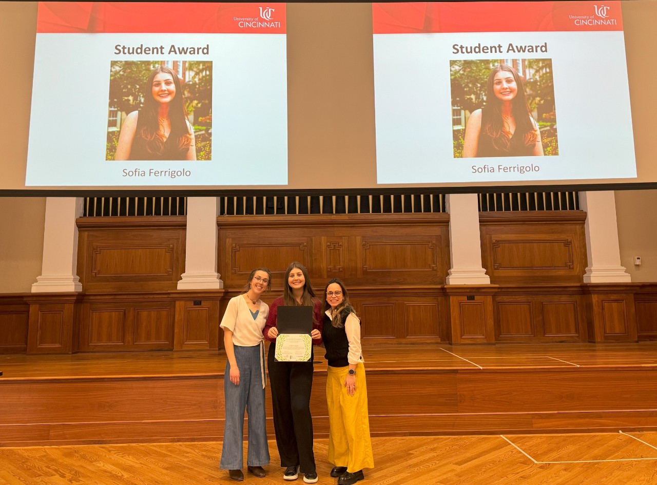 2025 Student Awardee with award & office staff