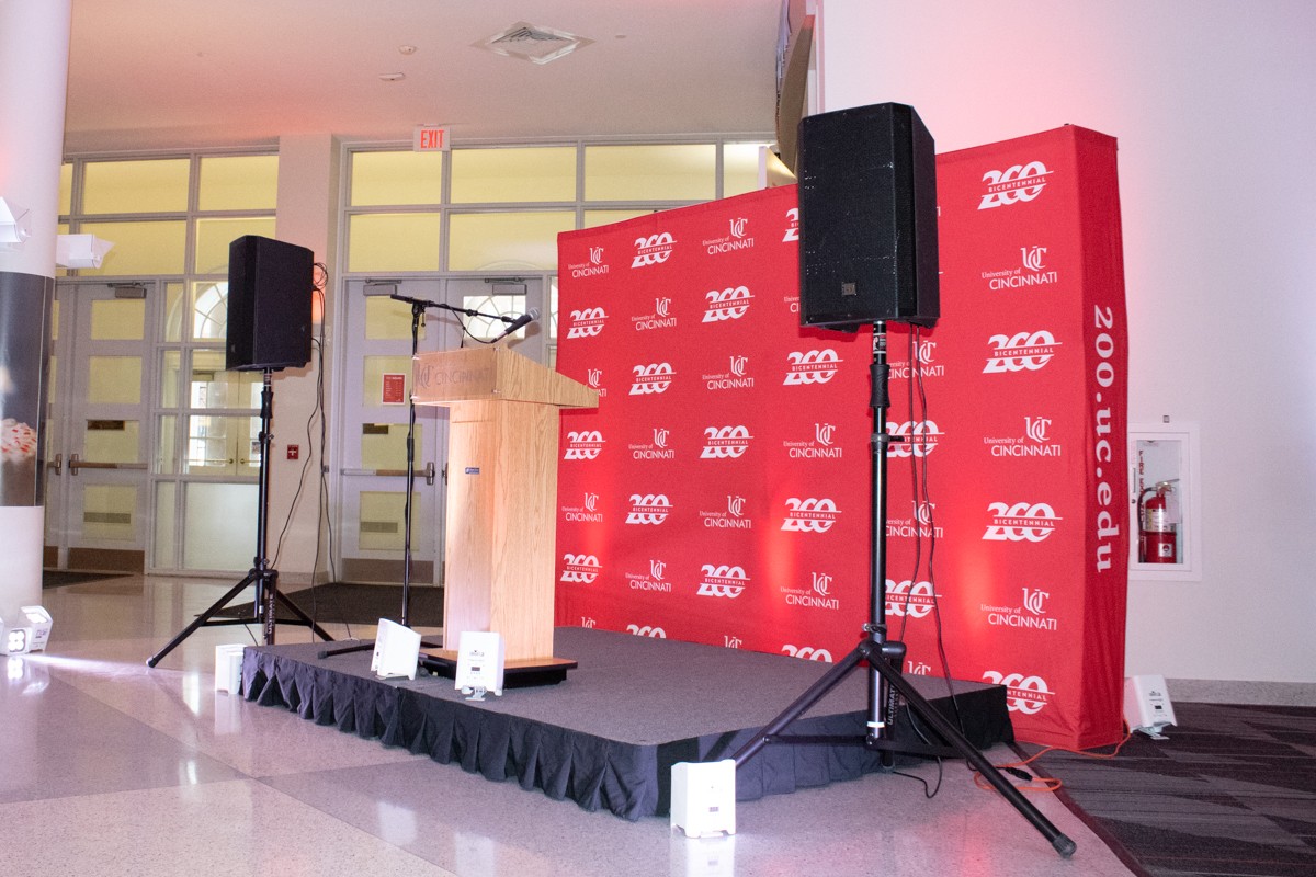 Small stage with podium and speakers.