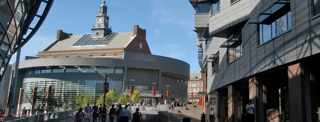 Image of staff and students walking up MainStreet on UC's campus.
