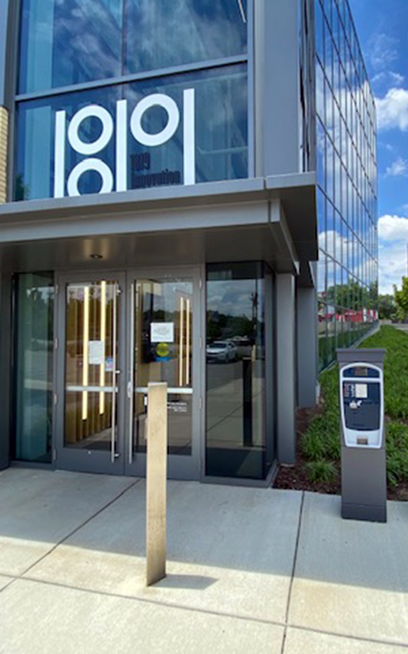 Entry door to 1819 Innovation Hub with pay station to the right of the door. 