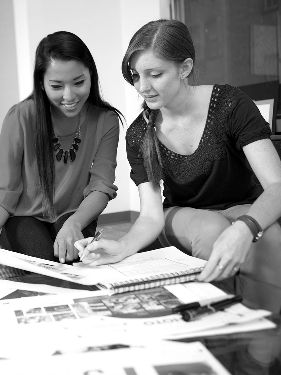 Two students working on design project