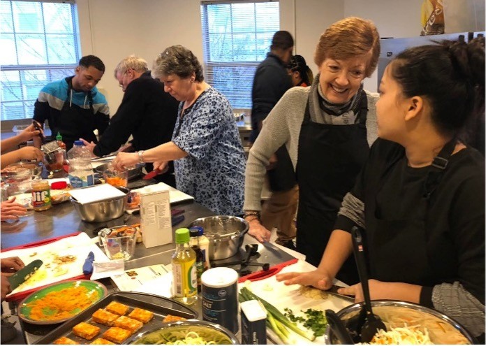 Emeriti member Pat Mezinskis cooking with a PR1ZE mentee