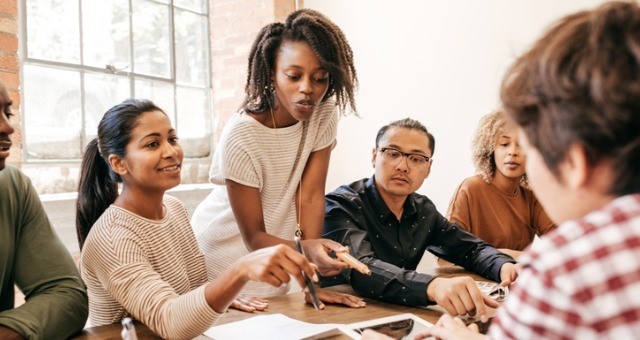 group of people working and talking