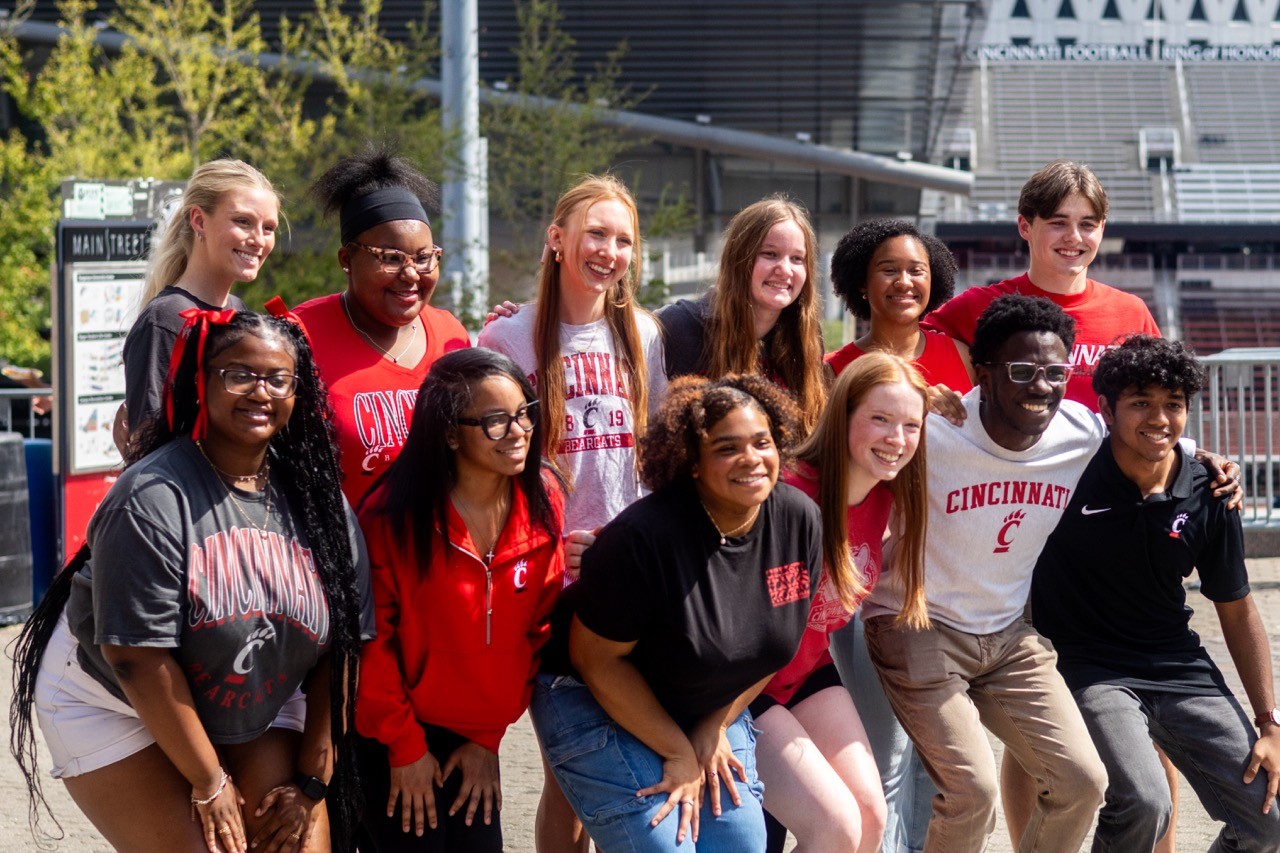 University of Cincinnati students smiling together for a photo