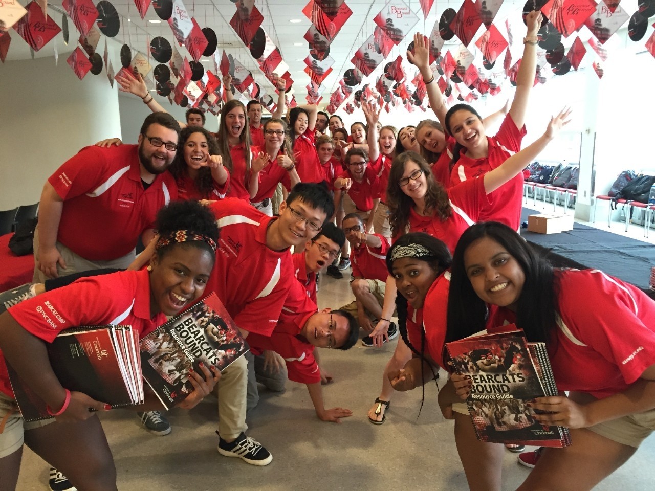 UC student orientation leaders pose during a team activity