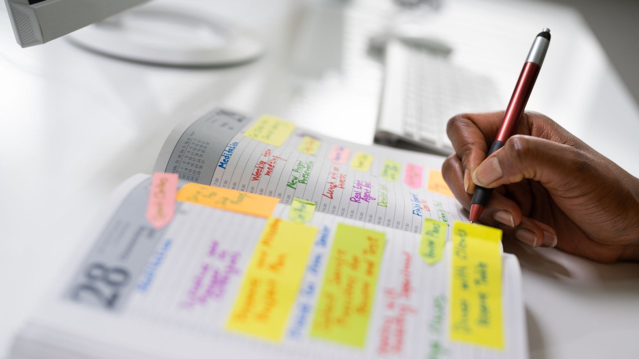 Staying organized by writing in a planner