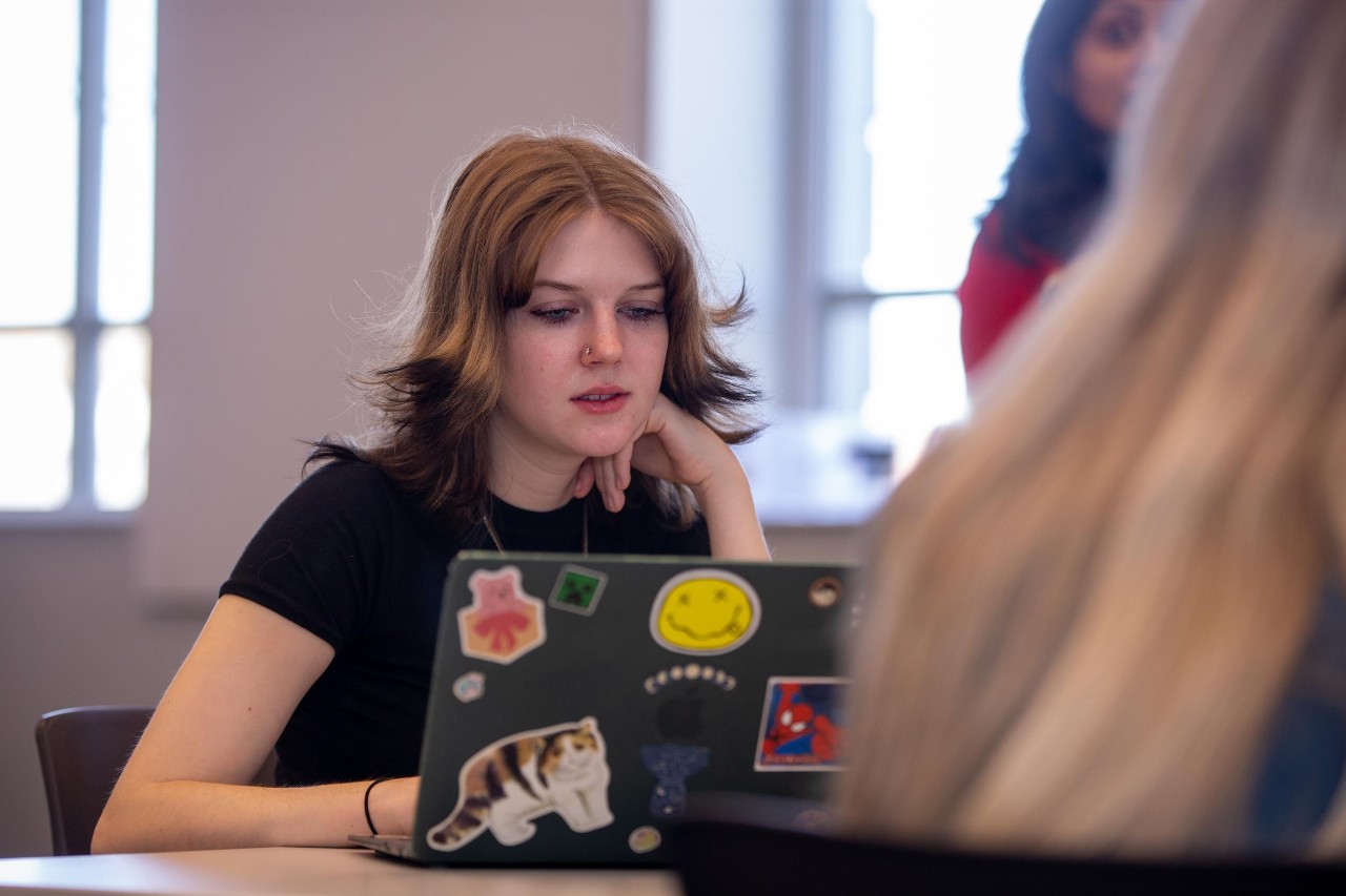 Student using laptop to set academic goals