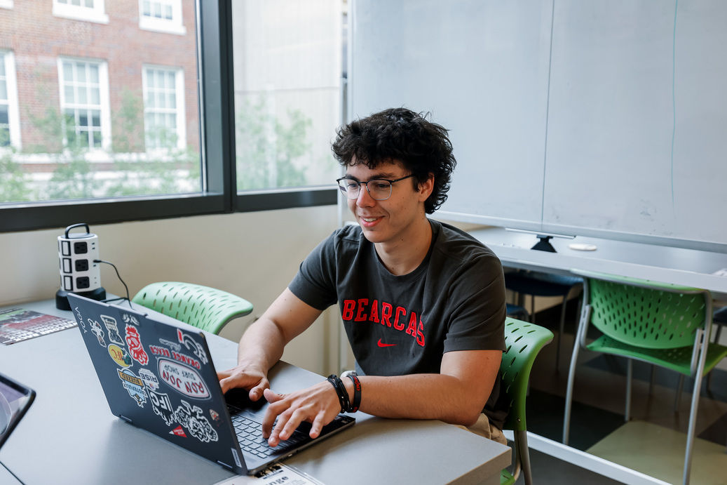 Student on laptop using AI in college