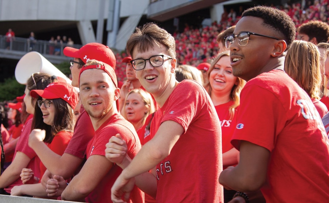 UC students learn the traditional "Down the Drive" cheer