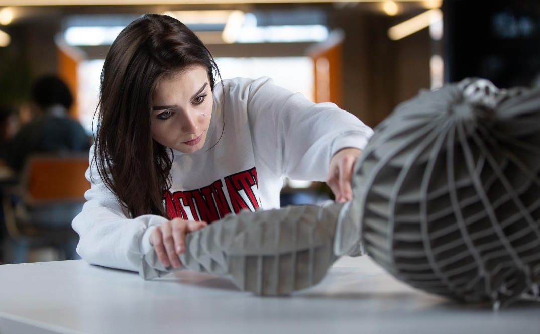 Students pose at 1819 Innovation Hub for a marketing campaign.