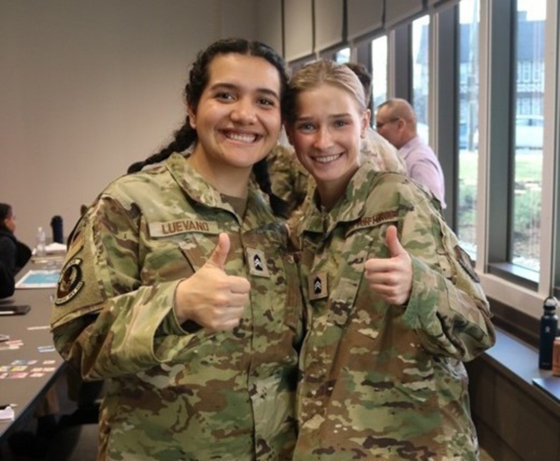 two cadets giving a thumbs up sign