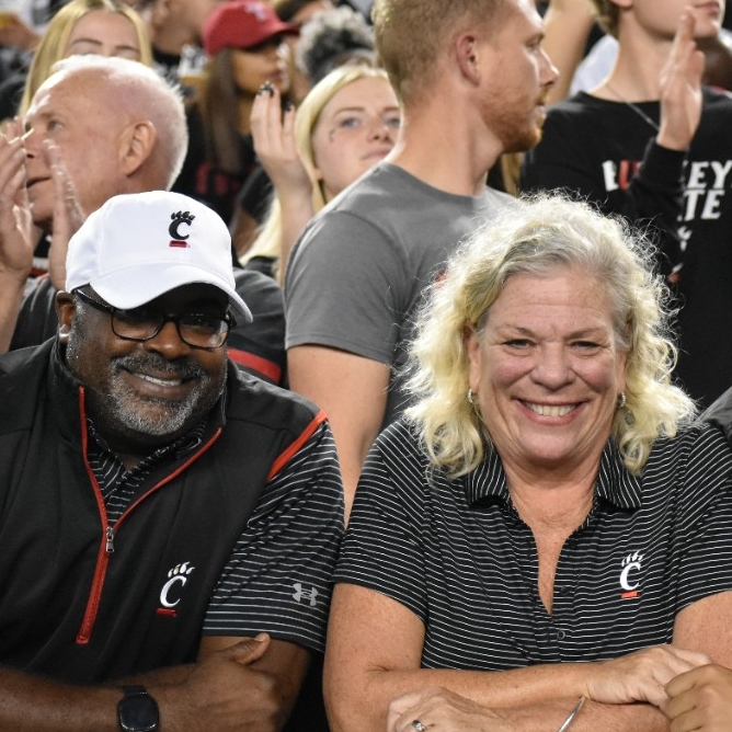 Family smiling at a football game