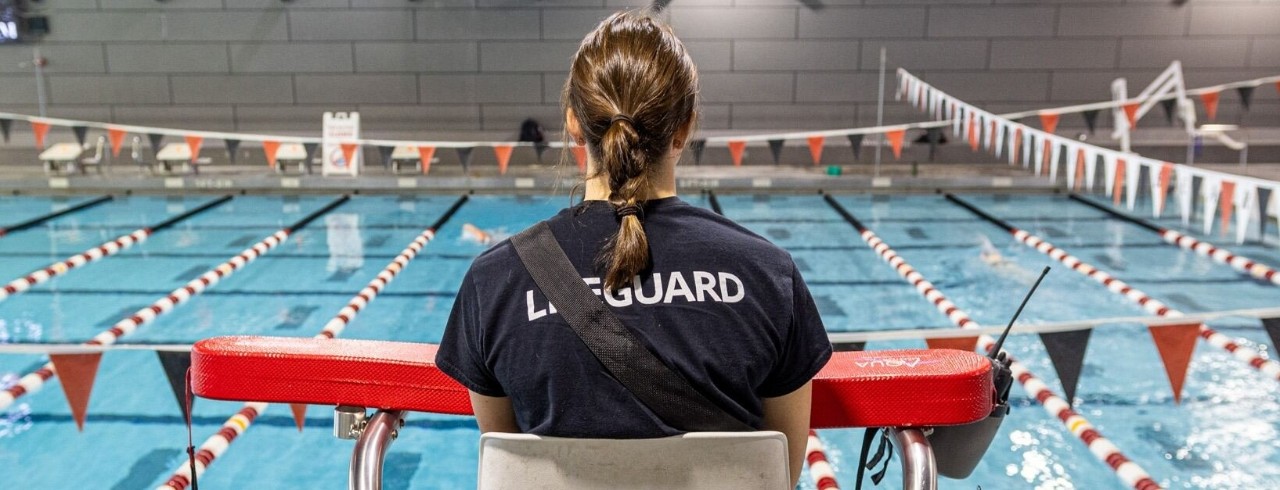 Trainer working with member at the Campus Recreation Center.