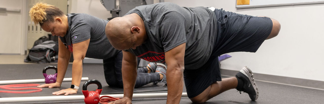 man and woman doing a personal training session