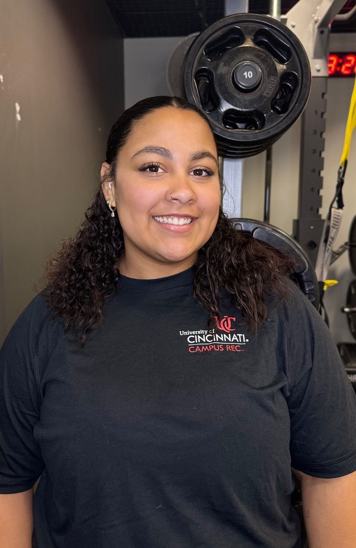 female standing in a fitness space 