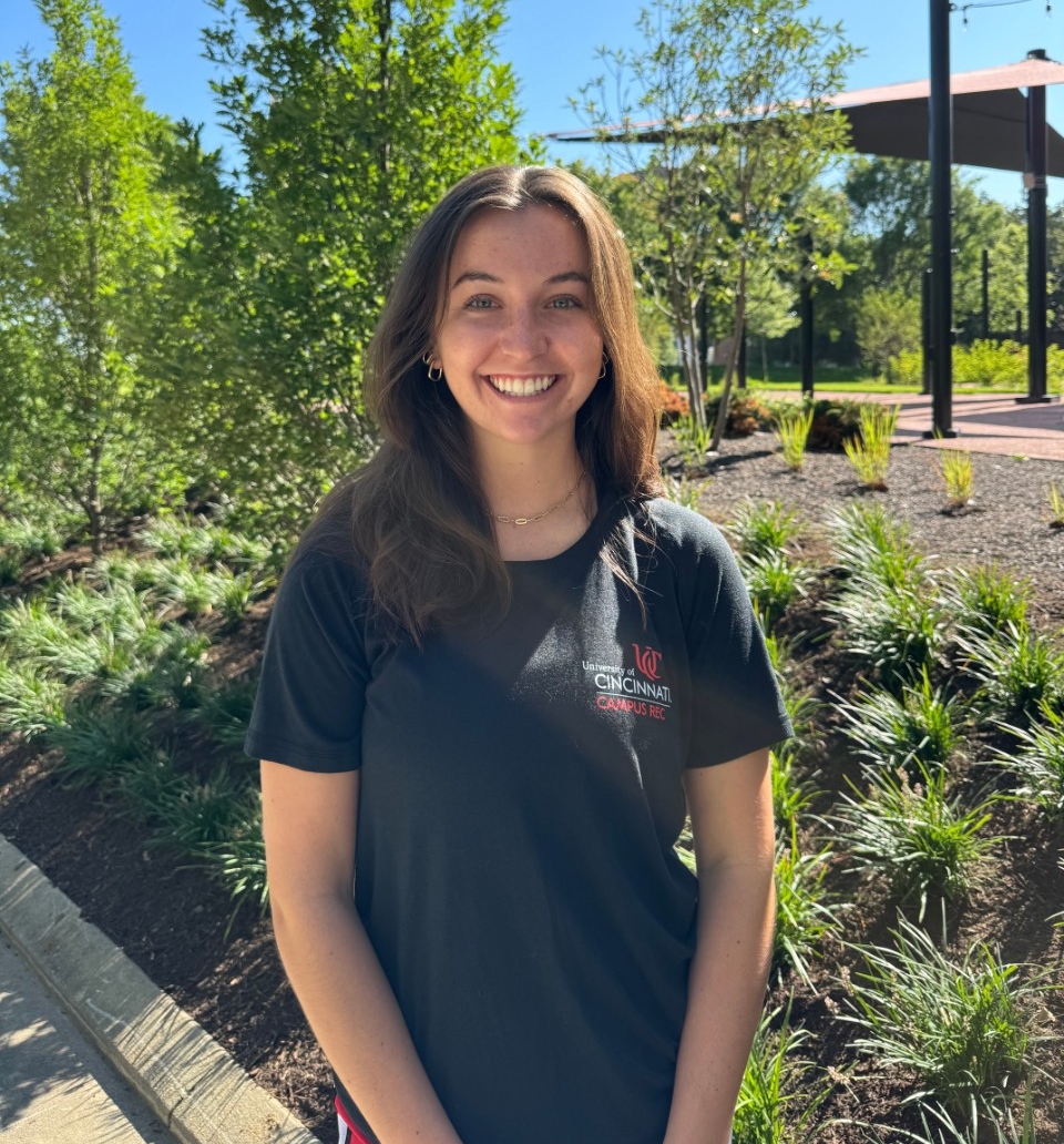 female posing for a photo outside