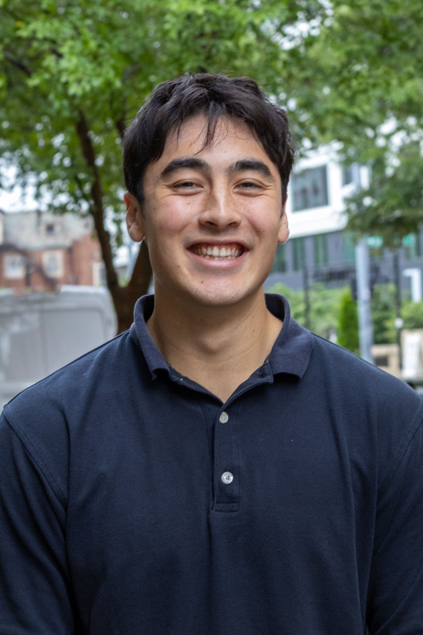 Gabe smiling outside of CAPS 
