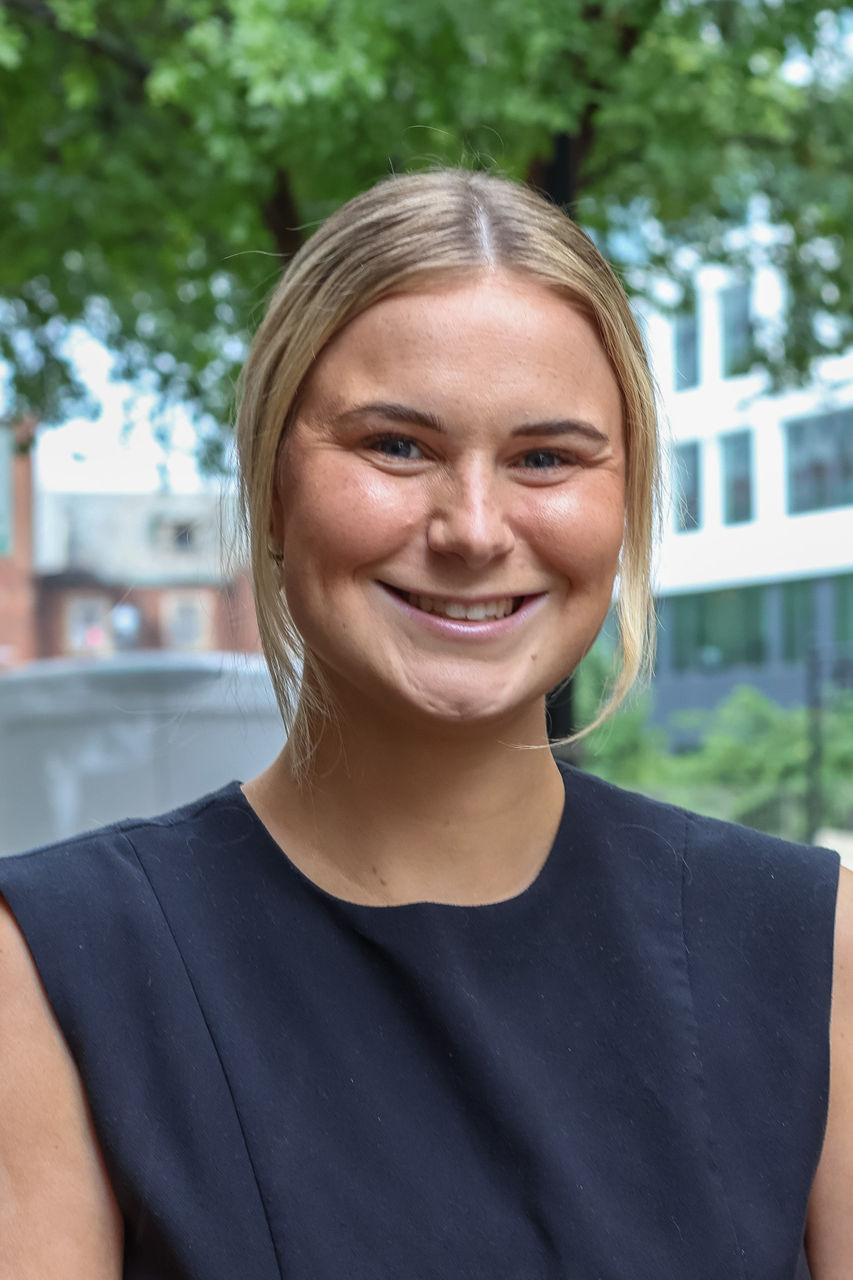 Kate smiling outside of CAPS office