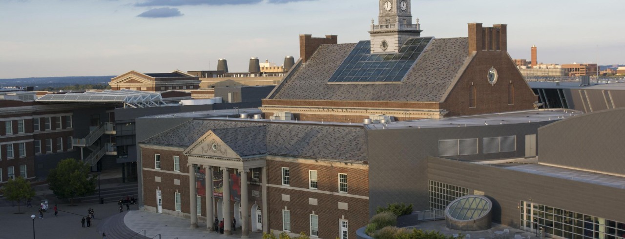 Aerial view of Tangeman University Center under a clear sky at dusk.
