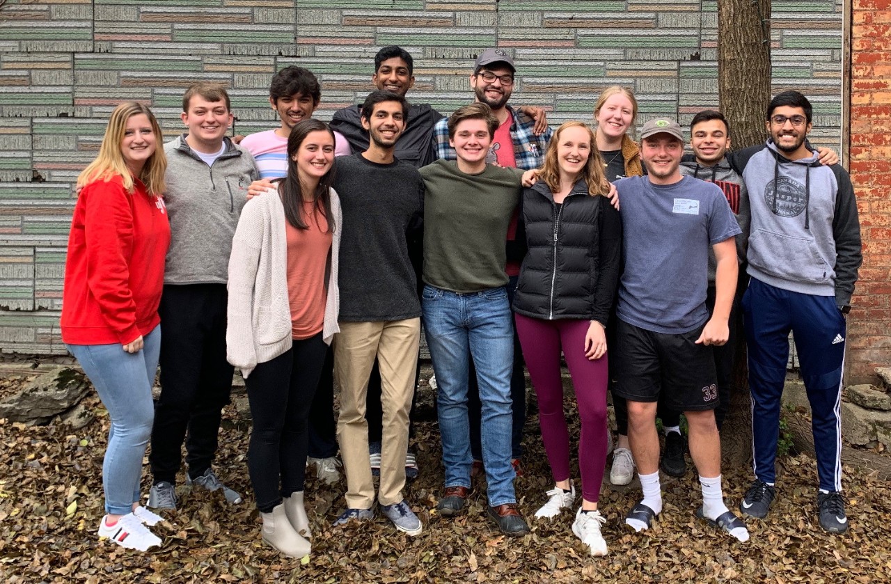 Picture of 13 UFB members from the 2019-20 board during a friends-giving event that they held.