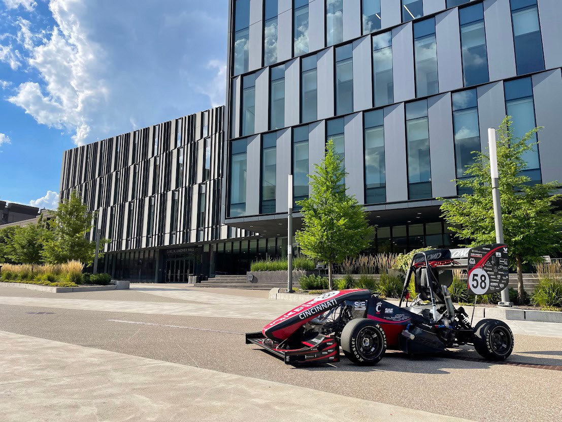 car built by competitive student organizations in front of Lindner College of Business