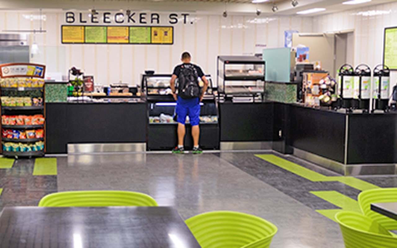 A student stands in line at the café.
