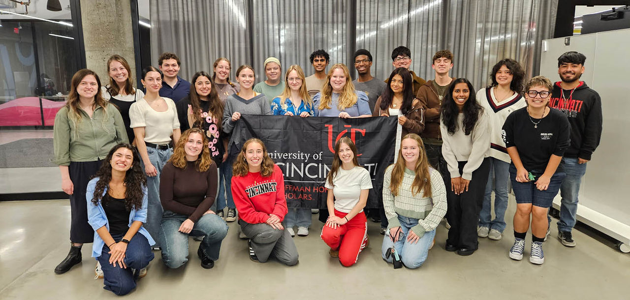 HHS cohort group photo with flag