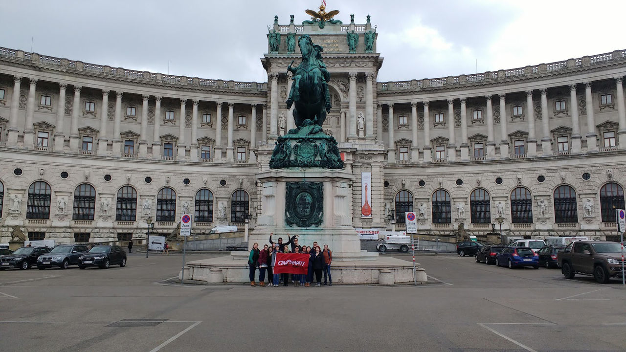 UC students pose with flag in Vienna