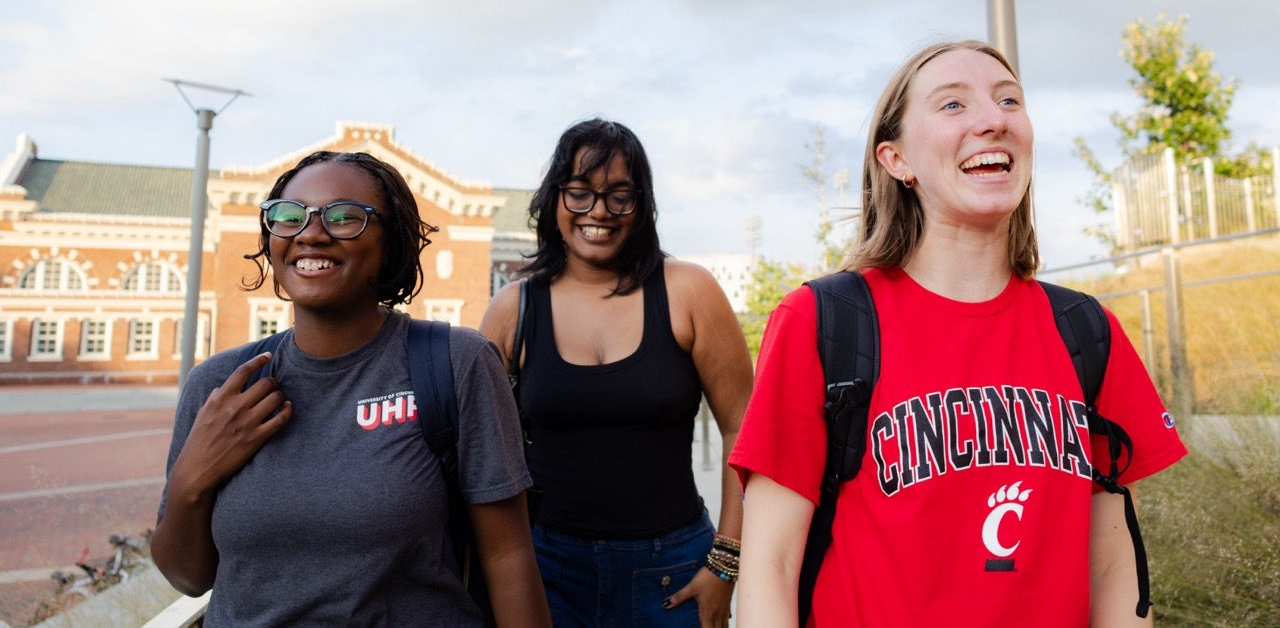 Students looking at a bulletin board on campus