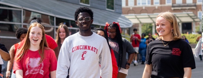 UHP students walking down main street smiling