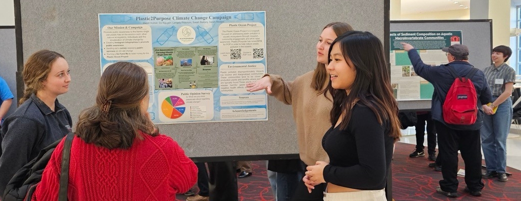 Students presenting their research poster